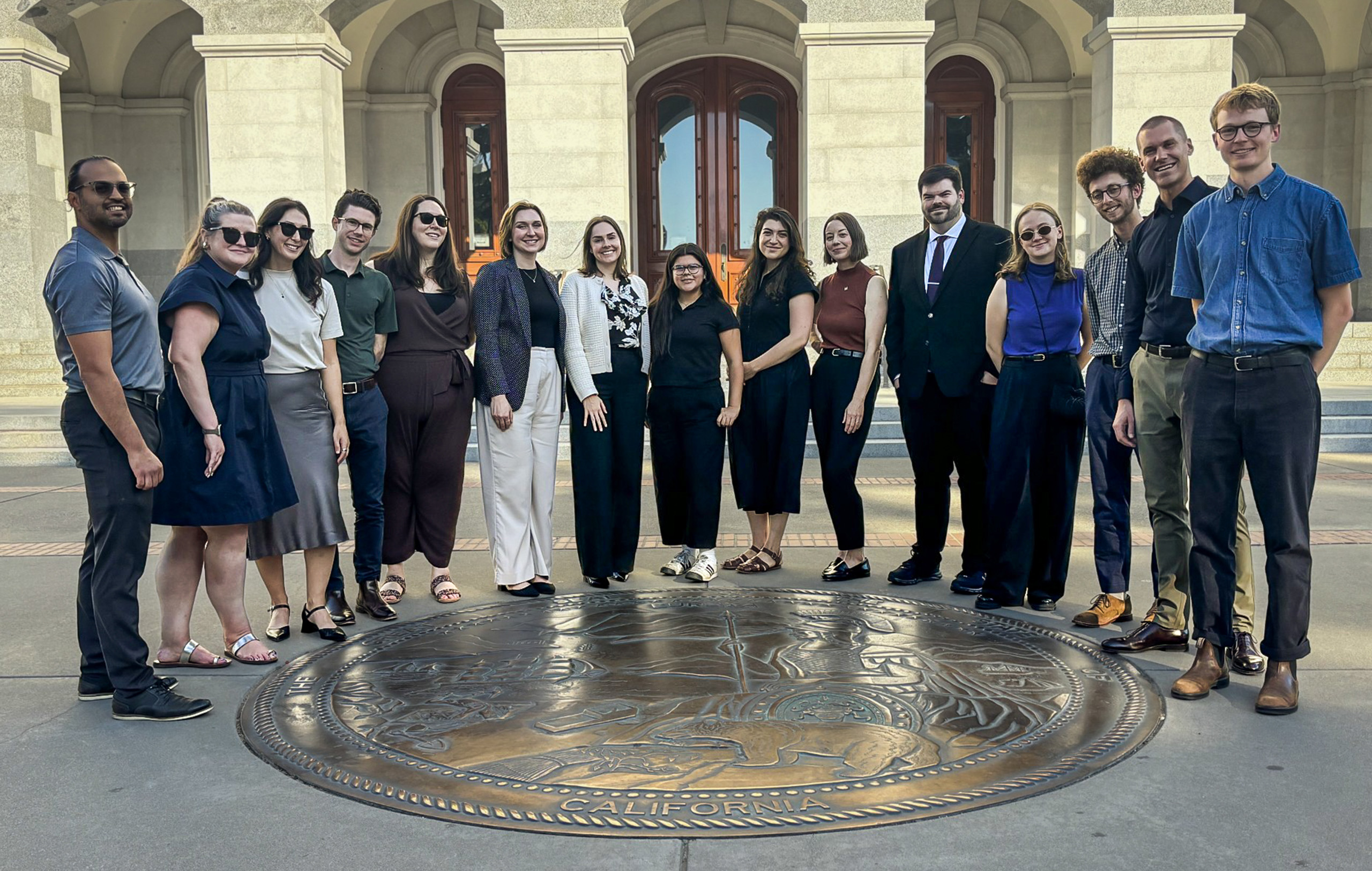 CMAP staff posing for a group shot in front of California State Capitol building