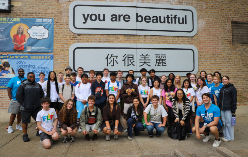 Future Leaders in Planning participants pose in front of a wall in Chinatown
