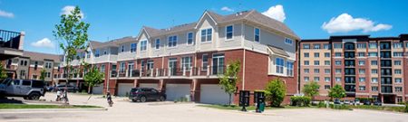 photograph of townhomes and an apartment building