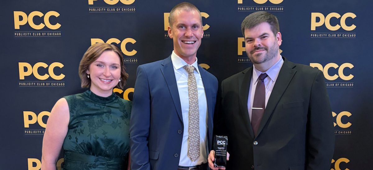 Two CMAP staff members posing with Publicity of Chicago award