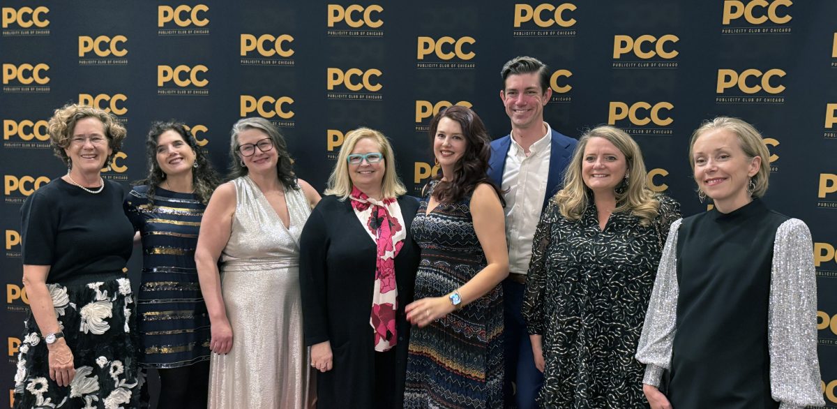Group of CMAP staff and consultants posing on red carpet