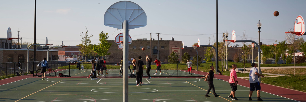 People playing basketball at outdoor public court