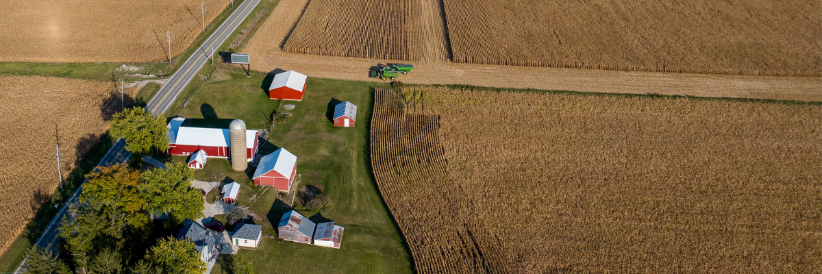 Aerial view of farm buildings and crops