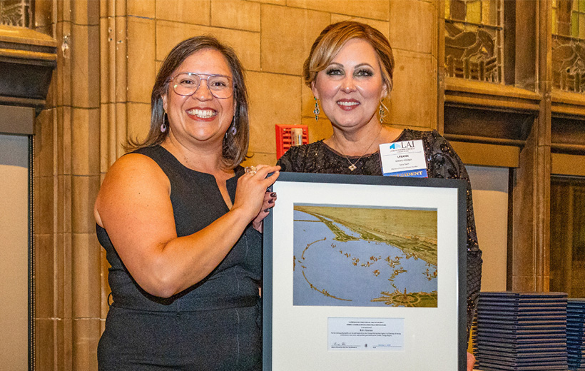 Erin Aleman presented with an award by the Chicago Region Chapter of Lambda Alpha International